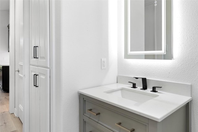 422 Mustang Dr, Sunnyvale, TX 75182 - bathroom featuring vanity and wood finished floors