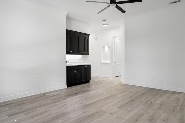 422 Mustang Dr, Sunnyvale, TX 75182 - unfurnished living room featuring ceiling fan, ornamental molding, light wood-style flooring, baseboards, and a sink
