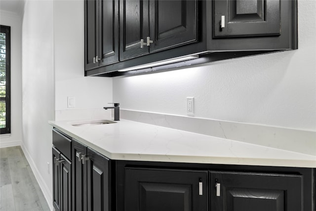 422 Mustang Dr, Sunnyvale, TX 75182 - bar with a sink, light wood-type flooring, healthy amount of natural light, and baseboards