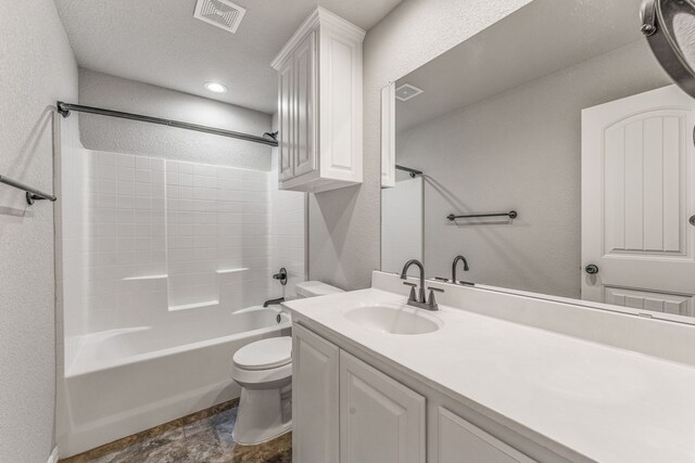 full bath featuring a textured wall, washtub / shower combination, vanity, toilet, and visible vents