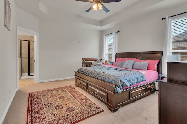 1728 Rio Secco Dr, Fort Worth, TX 76131 - bedroom featuring a raised ceiling, baseboards, light colored carpet, and ceiling fan