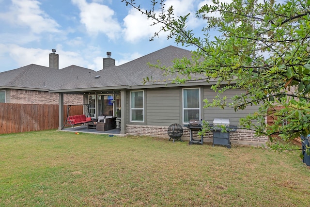 1728 Rio Secco Dr, Fort Worth, TX 76131 - rear view of house with outdoor lounge area, a fenced backyard, a yard, a patio, and brick siding
