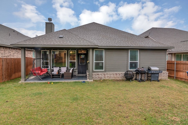1728 Rio Secco Dr, Fort Worth, TX 76131 - back of house with a fenced backyard, brick siding, an outdoor living space, a lawn, and roof with shingles