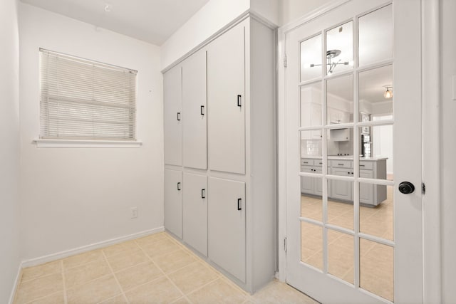 interior space featuring baseboards