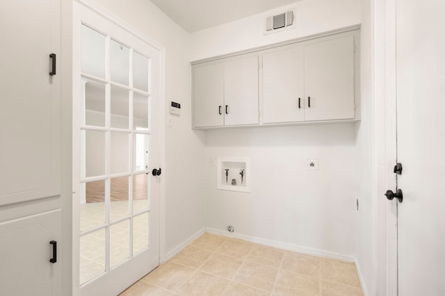 clothes washing area featuring baseboards, visible vents, washer hookup, hookup for an electric dryer, and cabinet space
