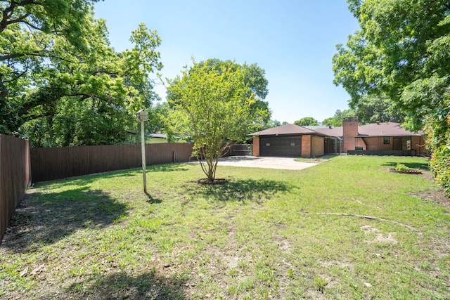 view of yard featuring a fenced backyard