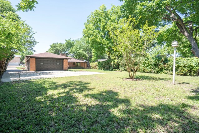 view of yard with an attached garage