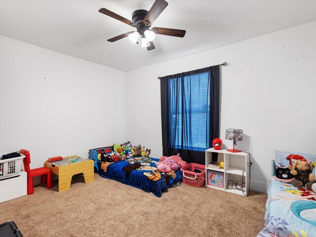 carpeted bedroom featuring a ceiling fan