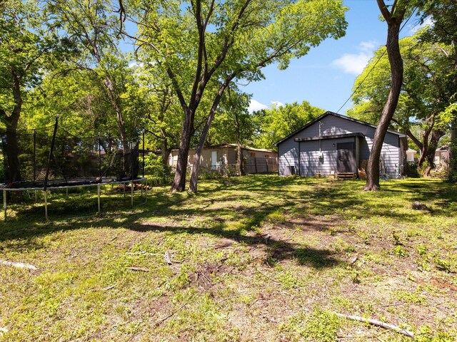 view of yard featuring a trampoline