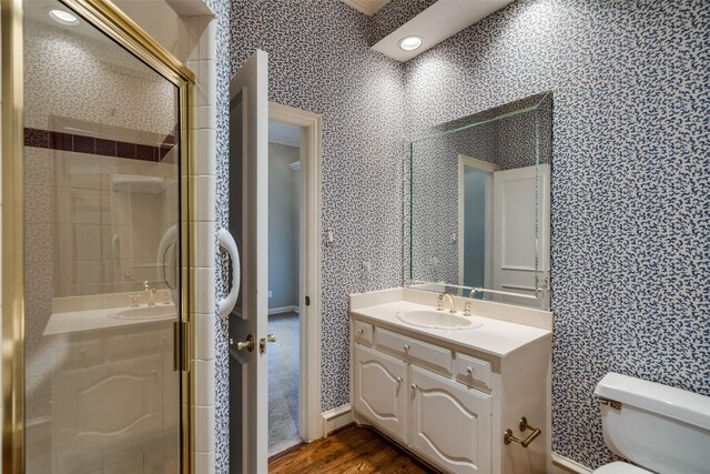 1405 Chesapeake Dr, Plano, TX 75093 - full bathroom featuring toilet, a shower stall, vanity, wood finished floors, and wallpapered walls