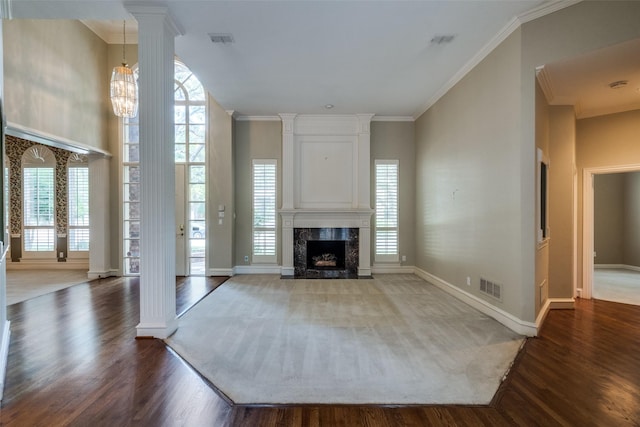 1405 Chesapeake Dr, Plano, TX 75093 - unfurnished living room with ornate columns, healthy amount of natural light, wood finished floors, and ornamental molding