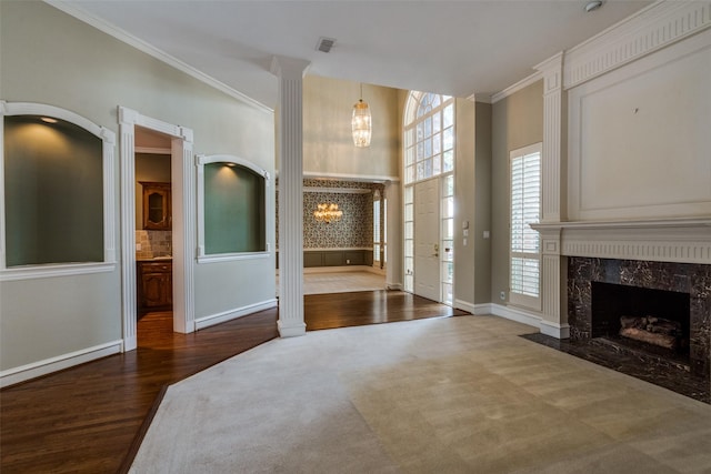 1405 Chesapeake Dr, Plano, TX 75093 - entrance foyer featuring a premium fireplace, wood finished floors, baseboards, crown molding, and carpet