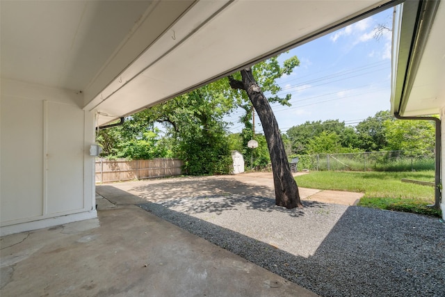 3319 Sheffield Dr, Arlington, TX 76013 - view of patio / terrace with a storage unit and an outbuilding