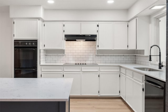 3319 Sheffield Dr, Arlington, TX 76013 - kitchen featuring a sink, under cabinet range hood, black appliances, backsplash, and recessed lighting