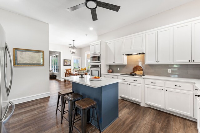 kitchen featuring a ceiling fan, open shelves, appliances with stainless steel finishes, and light countertops