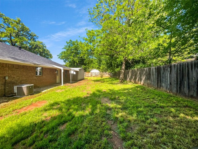 316 W 3rd Ter, Springtown, TX 76082 - view of yard with central AC unit and a fenced backyard