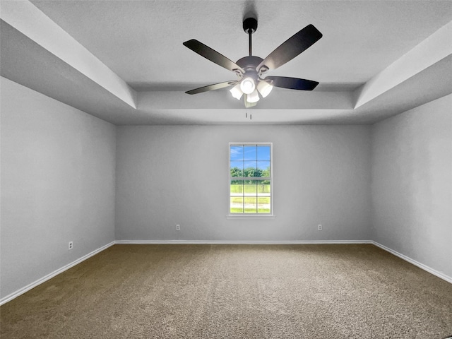 316 W 3rd Ter, Springtown, TX 76082 - carpeted spare room featuring ceiling fan, baseboards, and a tray ceiling