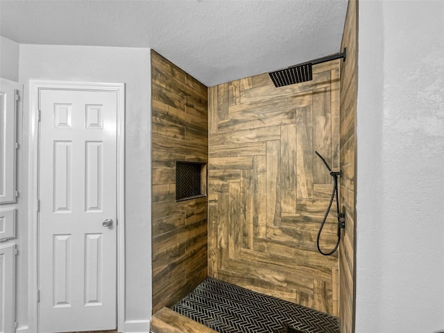 316 W 3rd Ter, Springtown, TX 76082 - bathroom featuring tiled shower and a textured ceiling