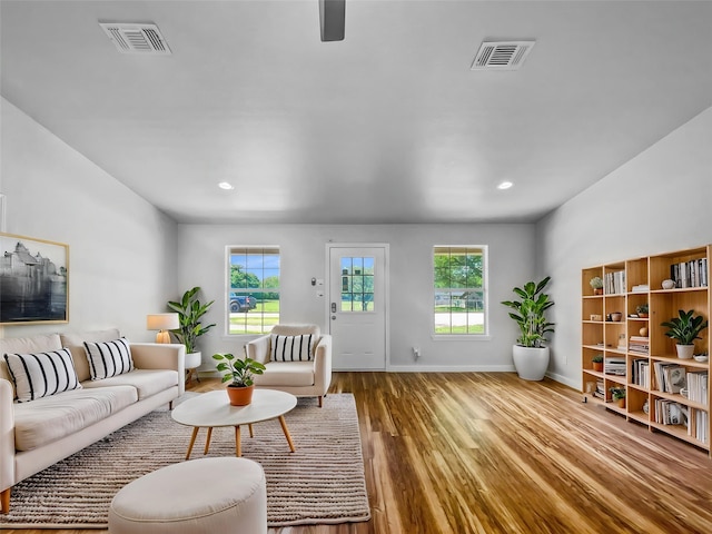 316 W 3rd Ter, Springtown, TX 76082 - living room featuring baseboards, visible vents, wood finished floors, and recessed lighting