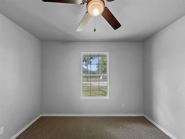 316 W 3rd Ter, Springtown, TX 76082 - unfurnished room with a ceiling fan, dark colored carpet, and baseboards
