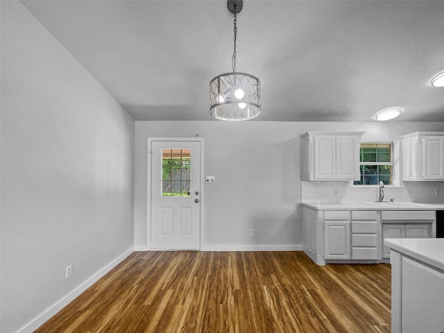 316 W 3rd Ter, Springtown, TX 76082 - kitchen with light countertops, white cabinets, baseboards, and dark wood-style flooring