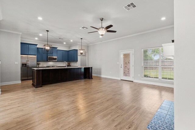 kitchen featuring blue cabinets, a ceiling fan, visible vents, and appliances with stainless steel finishes