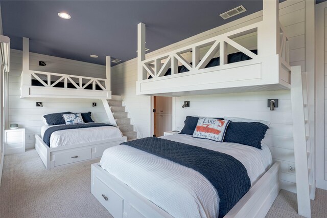 carpeted bedroom with visible vents and recessed lighting