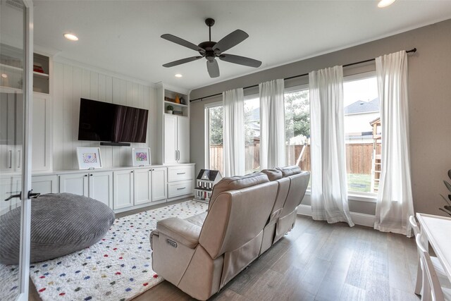living room with a ceiling fan, baseboards, recessed lighting, and light wood-type flooring