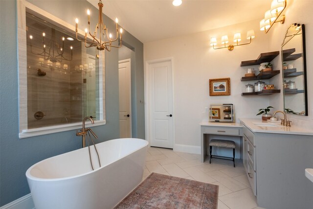 full bathroom with vanity, a freestanding tub, baseboards, a notable chandelier, and a tile shower