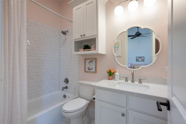 bathroom with vanity, a ceiling fan, shower / bathtub combination with curtain, and toilet