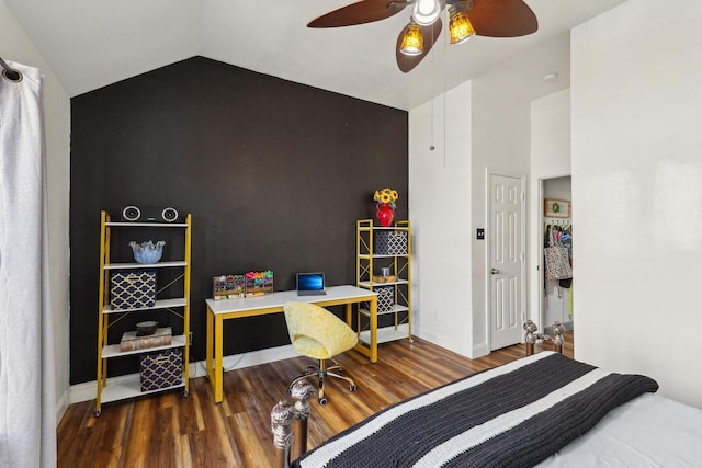 bedroom with lofted ceiling, baseboards, a ceiling fan, and wood finished floors