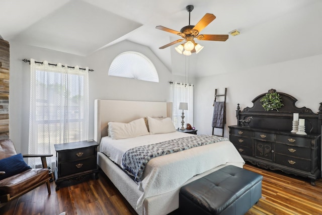 bedroom featuring a ceiling fan, dark wood-style flooring, and lofted ceiling