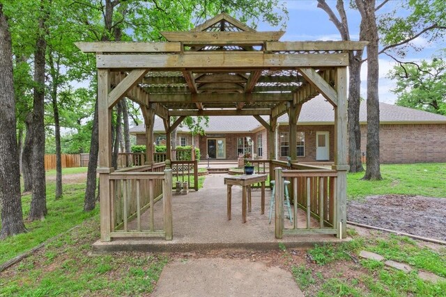 view of home's community featuring fence, a patio area, and a pergola
