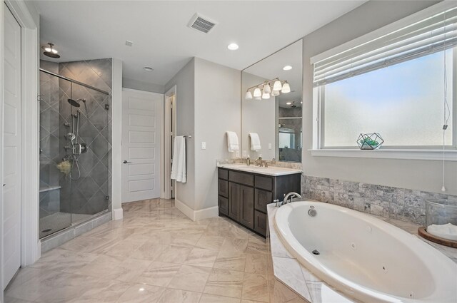 full bathroom featuring a tub with jets, marble finish floor, vanity, and a shower stall