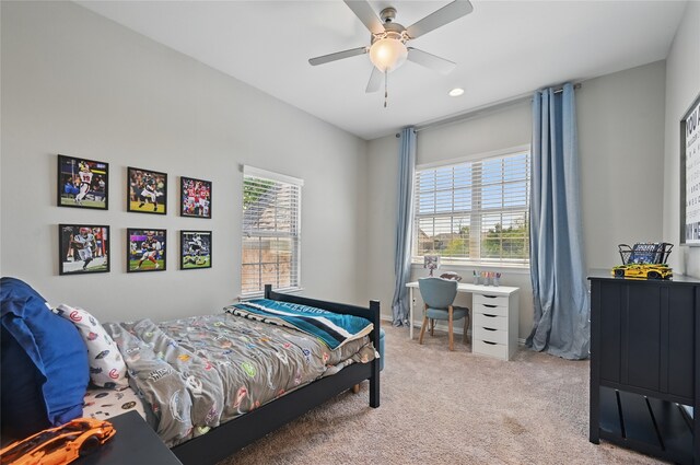 carpeted bedroom featuring ceiling fan