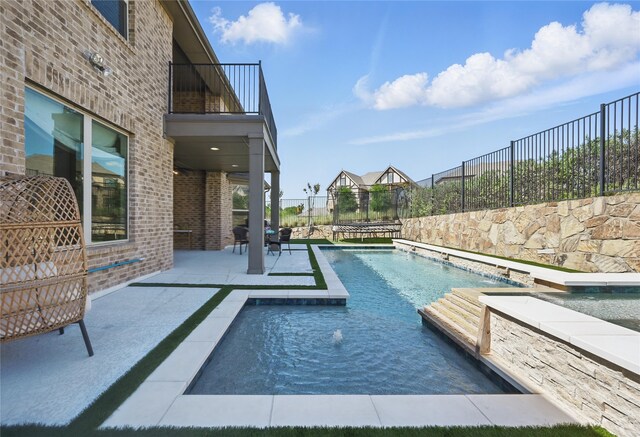 view of swimming pool featuring grilling area, a fenced backyard, a patio area, a lawn, and a ceiling fan