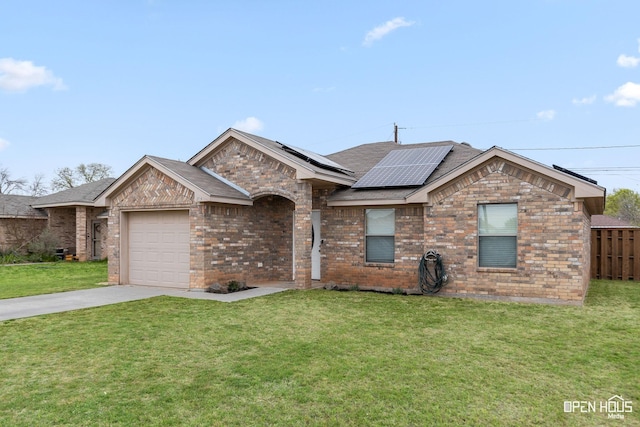ranch-style house with an attached garage, brick siding, a front yard, and concrete driveway