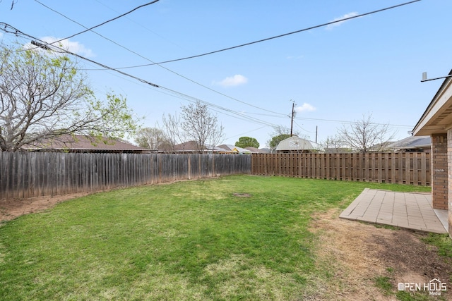 view of yard with a patio and a fenced backyard