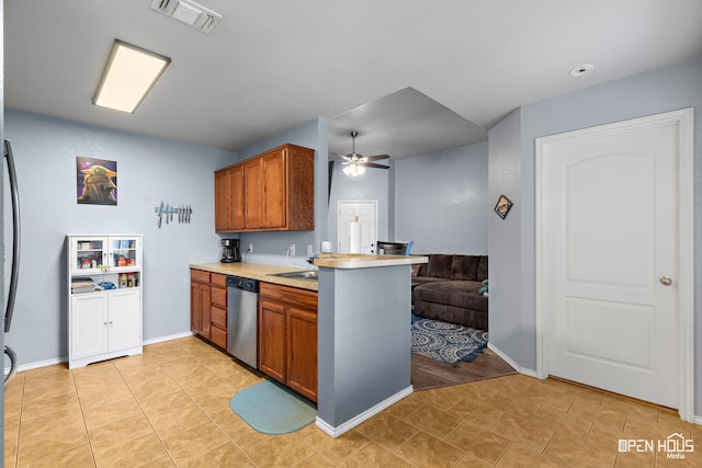 kitchen featuring ceiling fan, stainless steel dishwasher, visible vents, and light tile patterned floors