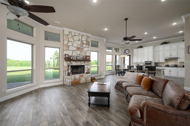 8636 Morgan Rd, Blue Ridge, TX 75424 - living room with ceiling fan, crown molding, wood finished floors, plenty of natural light, and baseboards