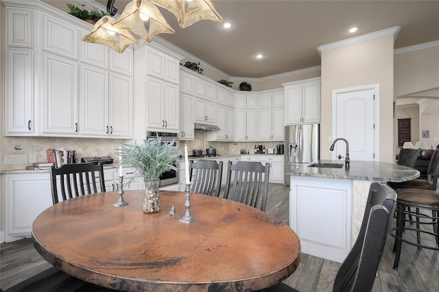8636 Morgan Rd, Blue Ridge, TX 75424 - dining space featuring dark wood-style floors, ornamental molding, and recessed lighting