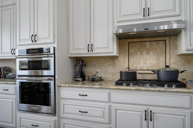 8636 Morgan Rd, Blue Ridge, TX 75424 - kitchen with under cabinet range hood, stainless steel appliances, backsplash, and white cabinets