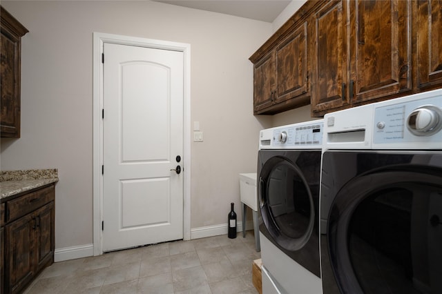 8636 Morgan Rd, Blue Ridge, TX 75424 - washroom featuring independent washer and dryer, baseboards, cabinet space, and light tile patterned flooring