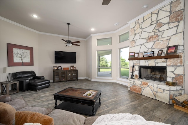 8636 Morgan Rd, Blue Ridge, TX 75424 - living area with a ceiling fan, crown molding, wood finished floors, a stone fireplace, and baseboards