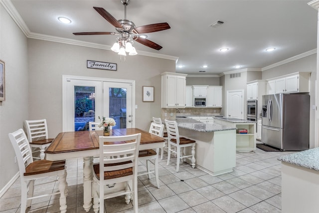 7021 Castle Creek Ct, Fort Worth, TX 76132 - dining area with ceiling fan, french doors, ornamental molding, visible vents, and recessed lighting