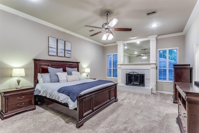 7021 Castle Creek Ct, Fort Worth, TX 76132 - carpeted bedroom featuring ornamental molding, a tile fireplace, visible vents, and ornate columns