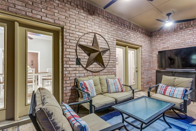 7021 Castle Creek Ct, Fort Worth, TX 76132 - living room featuring brick wall and a ceiling fan