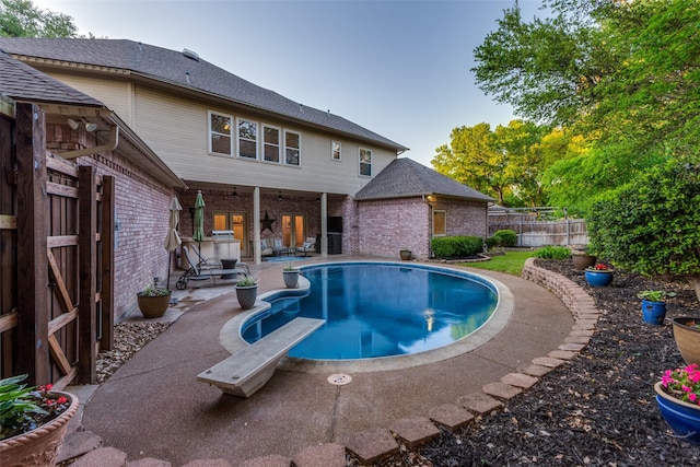 7021 Castle Creek Ct, Fort Worth, TX 76132 - view of swimming pool featuring a fenced backyard, a fenced in pool, a diving board, and a patio