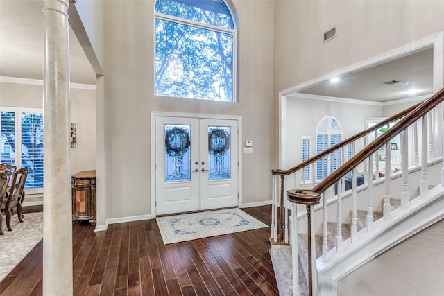 7021 Castle Creek Ct, Fort Worth, TX 76132 - foyer entrance featuring wood finished floors, visible vents, a towering ceiling, and baseboards