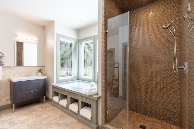 1228 Miller Rd, Melissa, TX 75454 - bathroom with a shower stall, vanity, and decorative backsplash